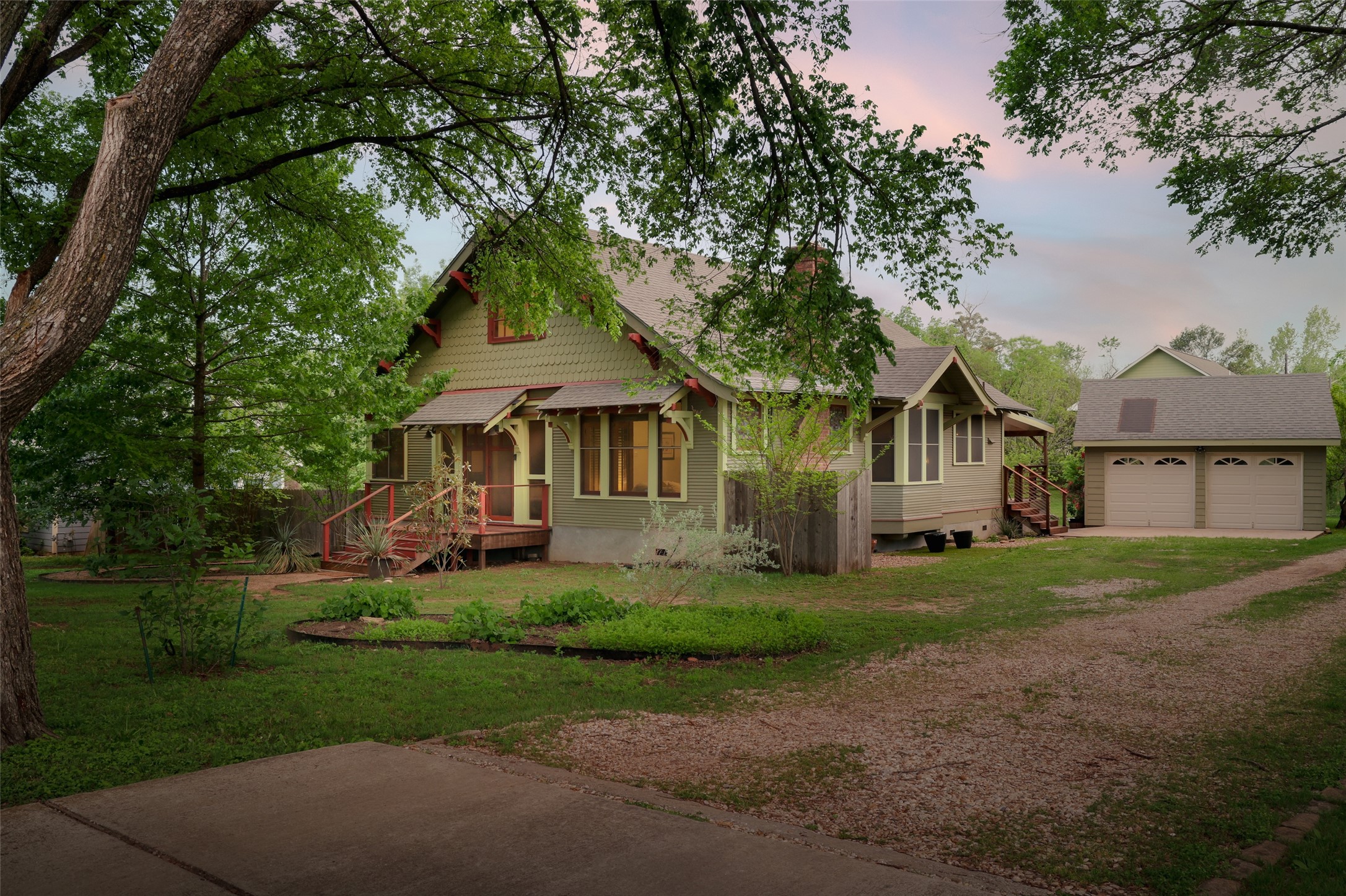 1917 Miles Avenue Austin, TX 78745 - Photo 27 of 39 a front view of a house with a garden and trees