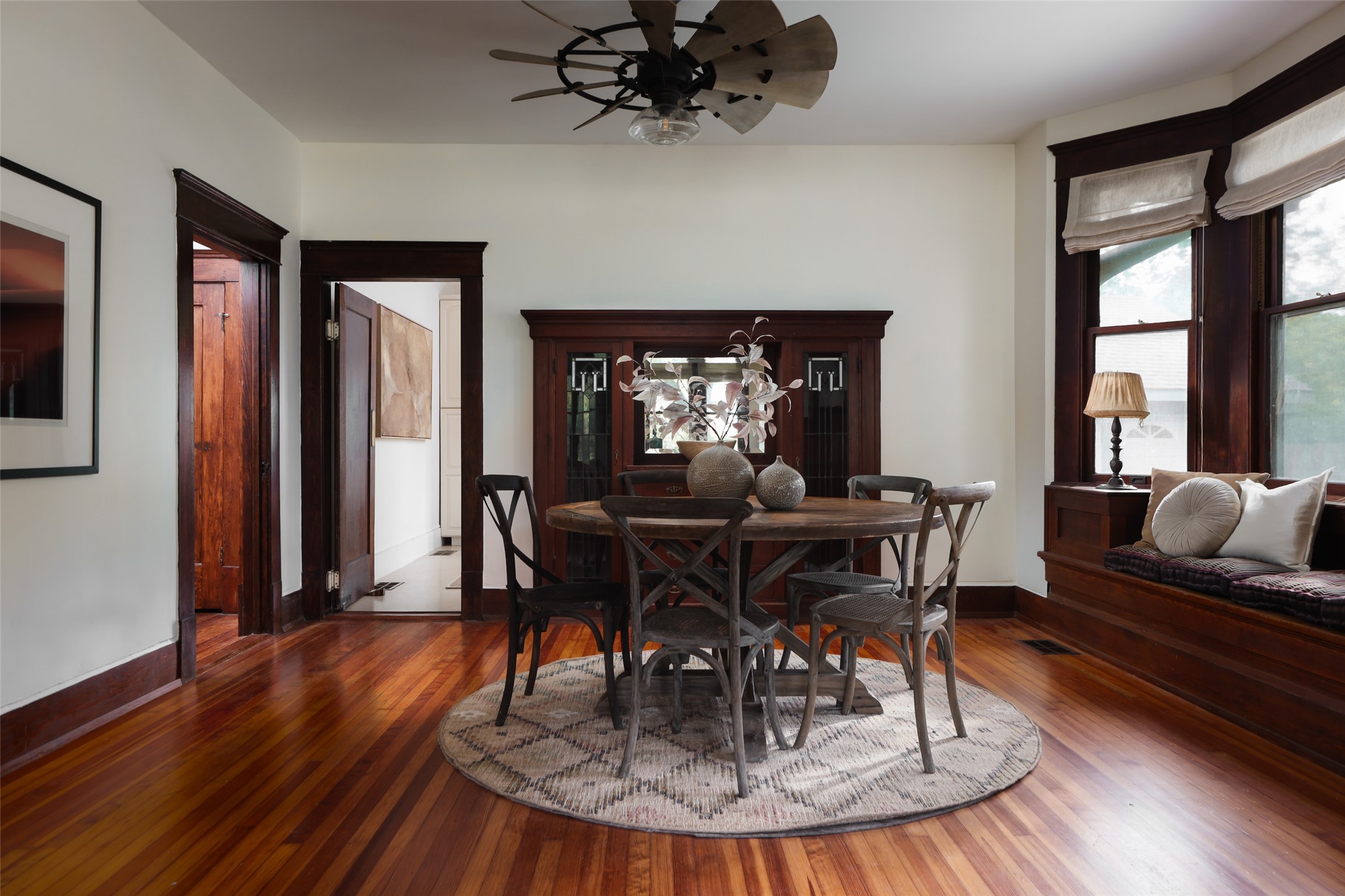 1917 Miles Avenue Austin, TX 78745 - Photo 9 of 39 a dining room with wooden floor a glass table and chairs