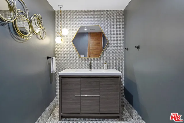 a living room with furniture and painting on the wall