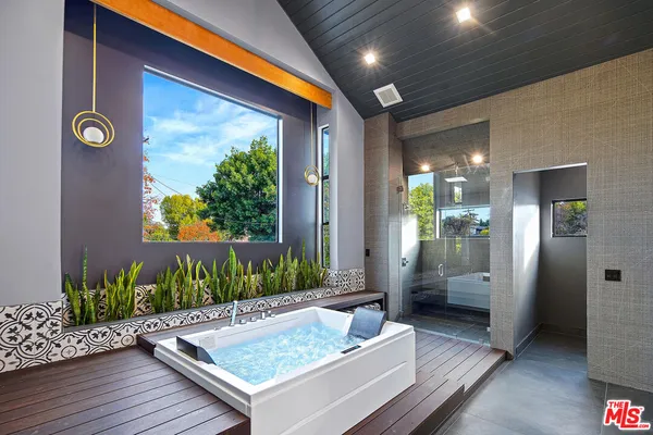 a living room with furniture and flowers