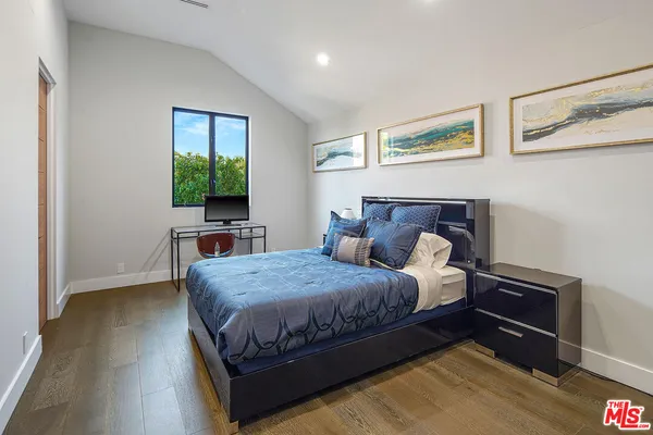 a bathroom with a sink vanity and a mirror