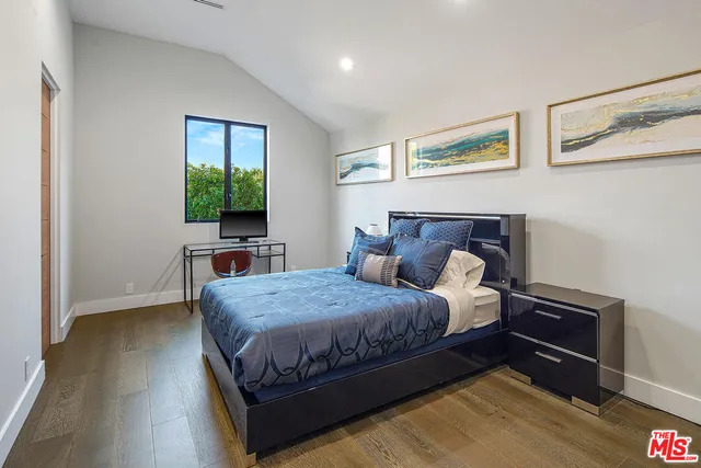 a bathroom with a sink vanity and a mirror