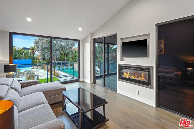 a bedroom with a large bed and a large window