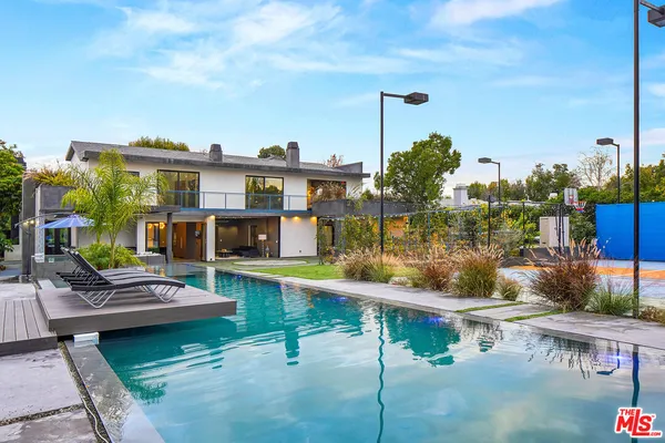 a view of swimming pool with a yard