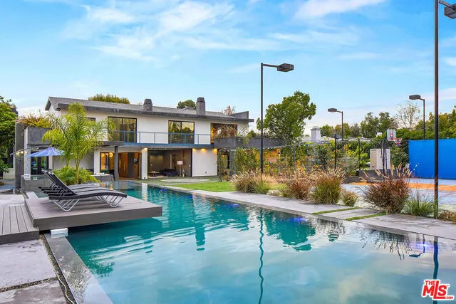 a view of swimming pool with a yard