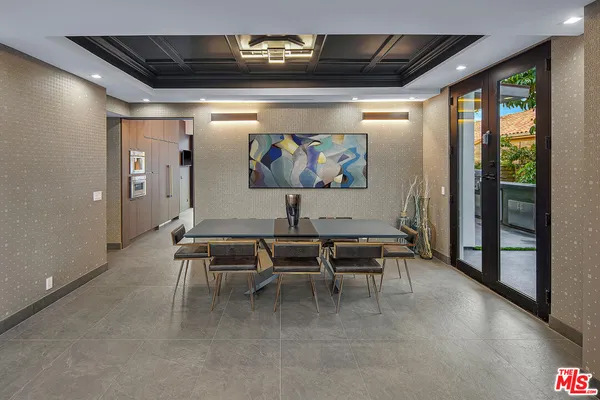 a very nice looking dining room with a large window