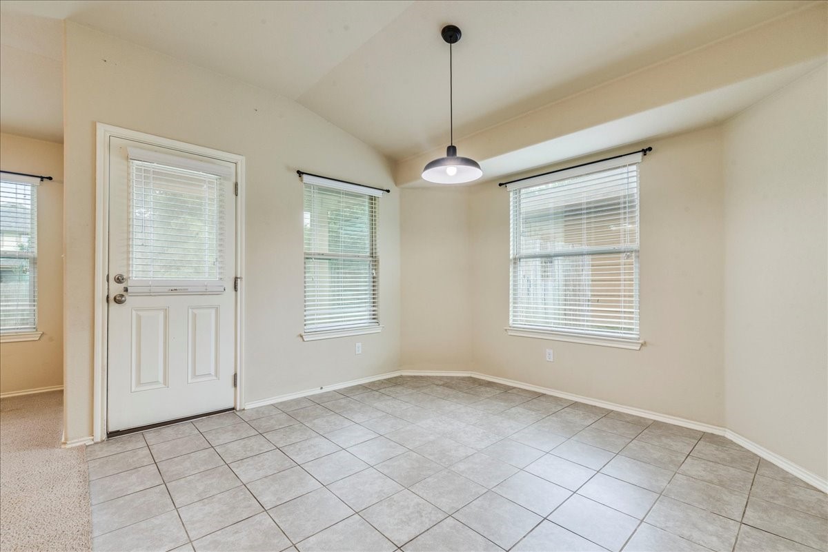 1061 Violet Lane Kyle, TX 78640 - Photo 10 of 34 Dining area with tile flooring, and abundance of natural light