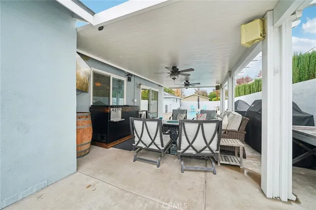 a view of a dining room with furniture and a window