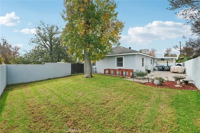 a view of a backyard with a garden and plants