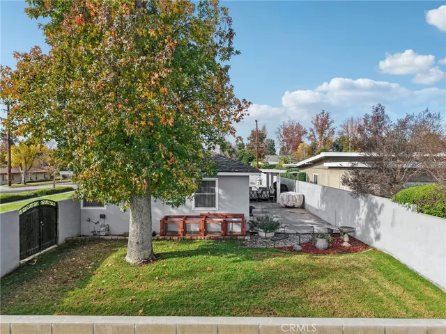 a view of a house with a yard porch and sitting area