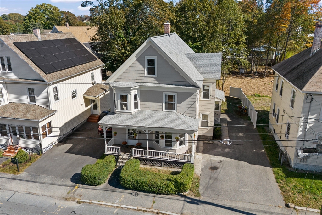 a aerial view of a house with a yard