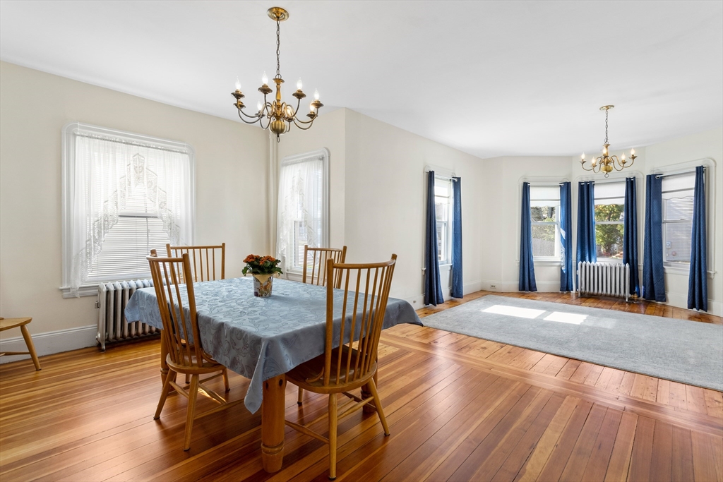 6 Barker Street Methuen, MA 01844 - Photo 13 of 42 a view of a dining room with furniture window and wooden floor