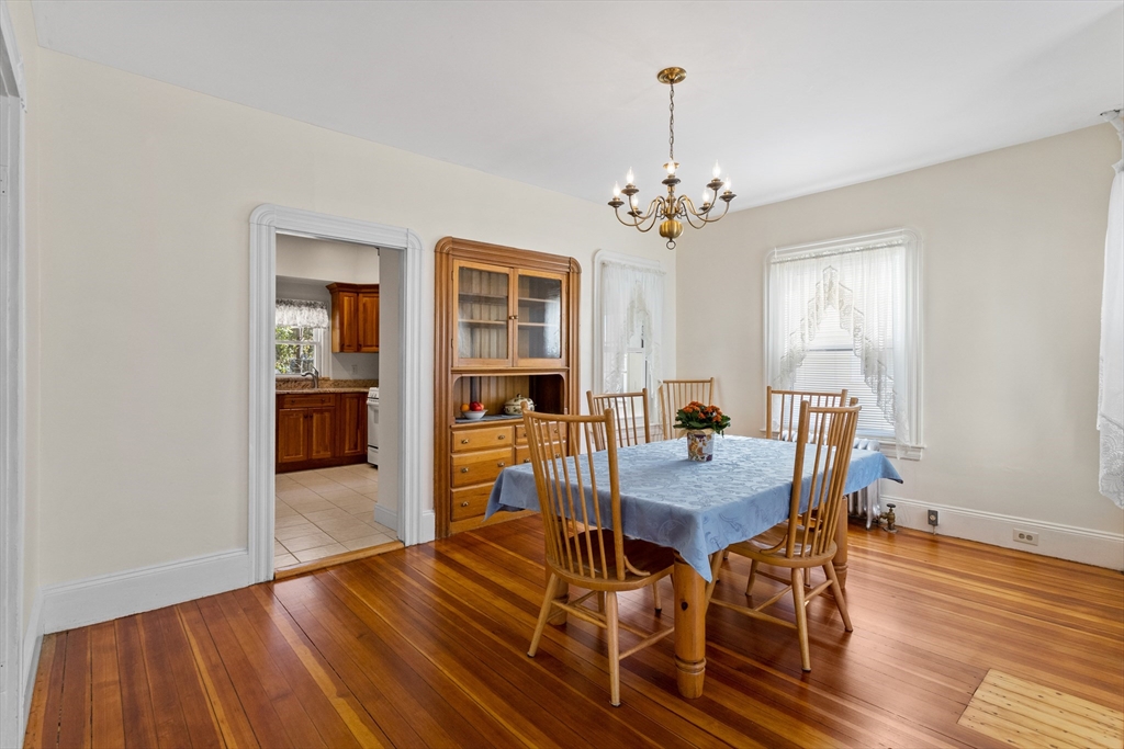 6 Barker Street Methuen, MA 01844 - Photo 14 of 42 a view of a dining room with furniture window and wooden floor