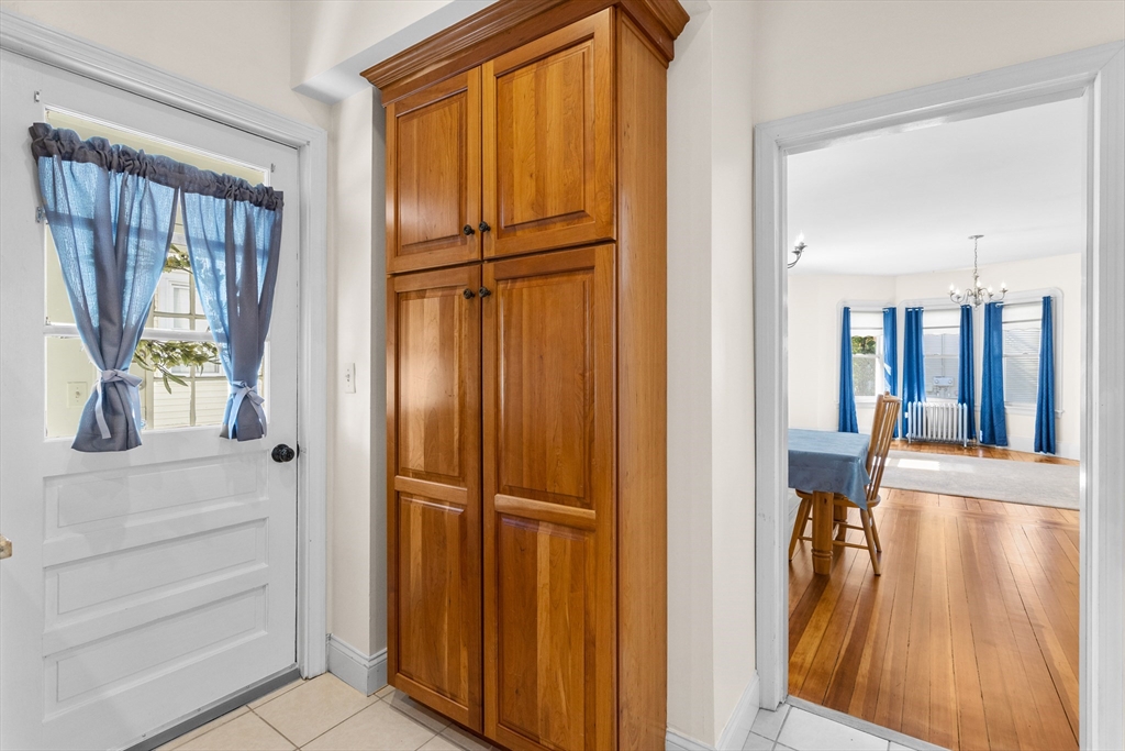 6 Barker Street Methuen, MA 01844 - Photo 17 of 42 a view of a hallway with wooden floor and staircase