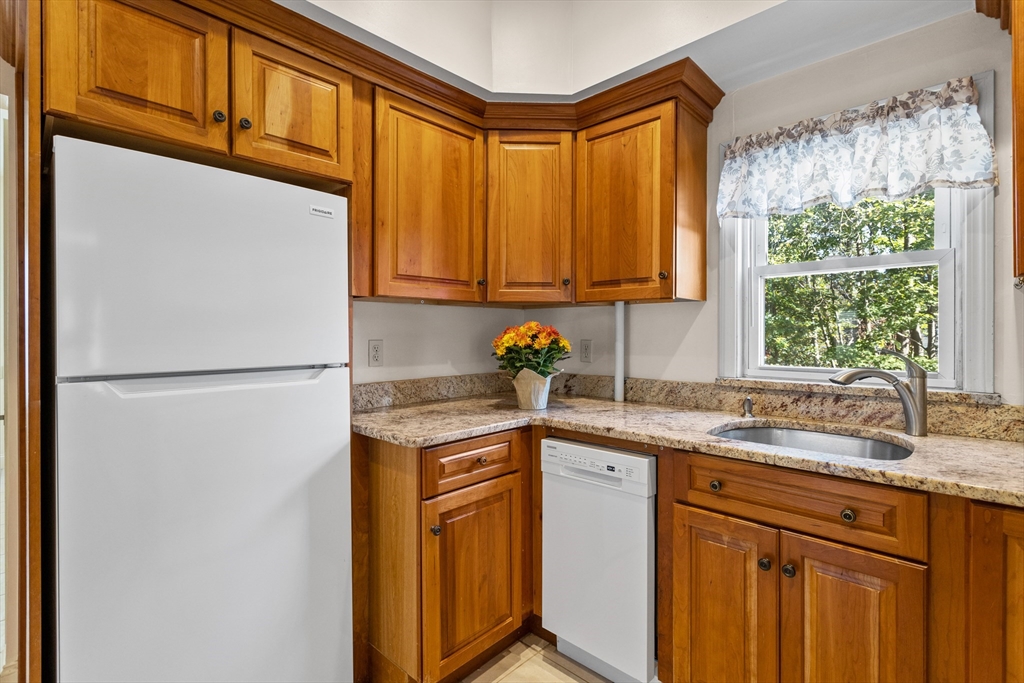 6 Barker Street Methuen, MA 01844 - Photo 19 of 42 a kitchen with stainless steel appliances granite countertop a refrigerator sink and cabinets