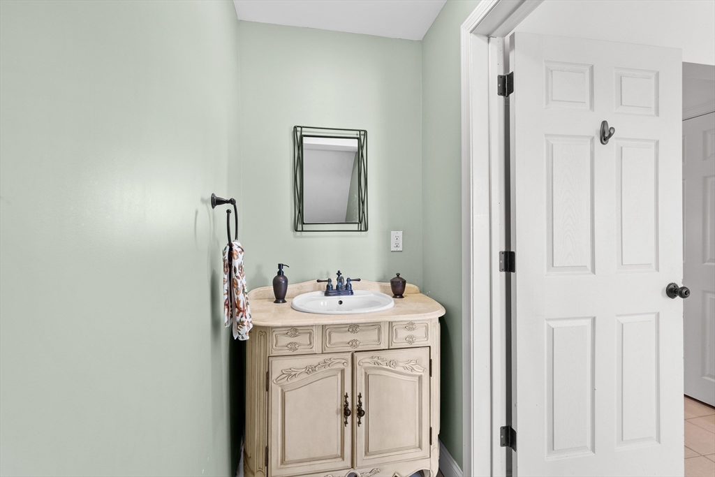 6 Barker Street Methuen, MA 01844 - Photo 20 of 42 a bathroom with a sink and a mirror