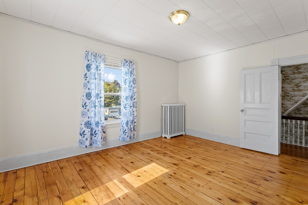 6 Barker Street Methuen, MA 01844 - Photo 23 of 42 a bedroom with a bed and a window