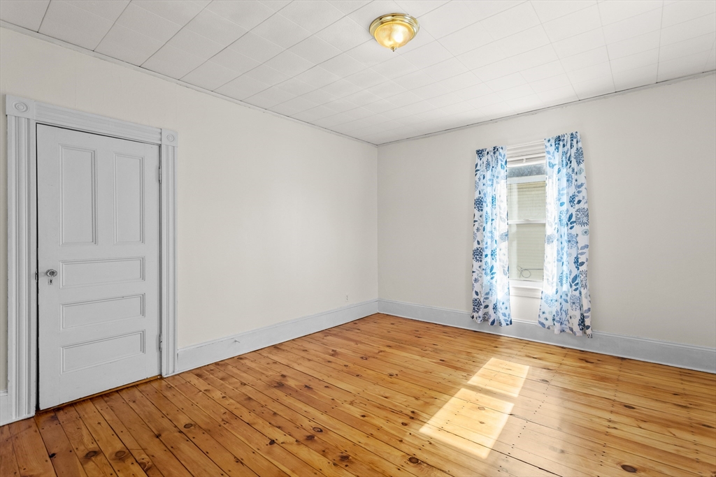6 Barker Street Methuen, MA 01844 - Photo 24 of 42 a view of empty room with wooden floor