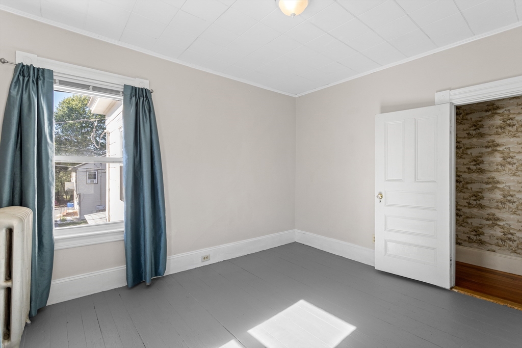 6 Barker Street Methuen, MA 01844 - Photo 27 of 42 wooden floor in an empty room with a window