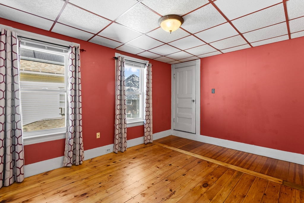 6 Barker Street Methuen, MA 01844 - Photo 30 of 42 a view of empty room with wooden floor