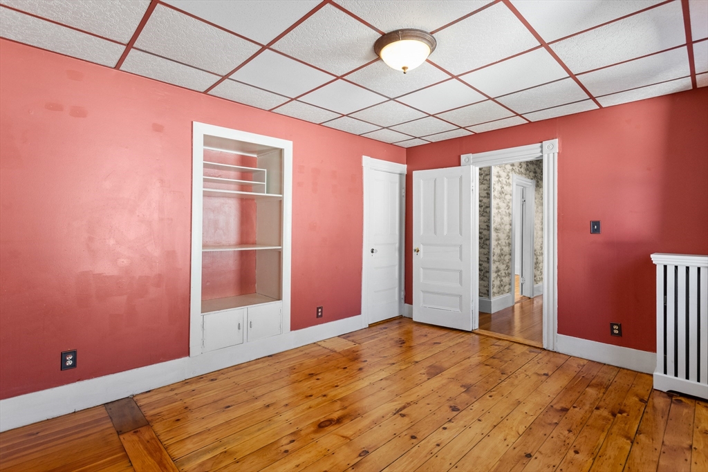 6 Barker Street Methuen, MA 01844 - Photo 31 of 42 a view of empty room with wooden floor