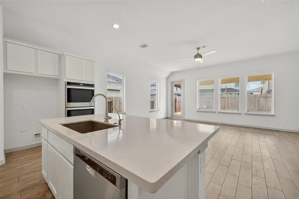 a kitchen with a sink and a refrigerator