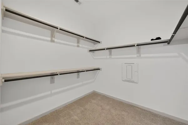 an empty room with closet area