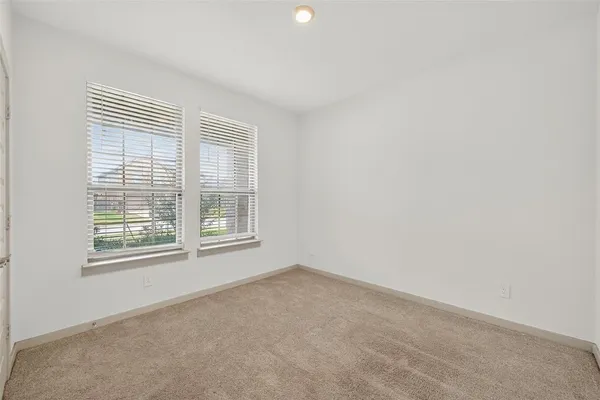 an empty room with closet area