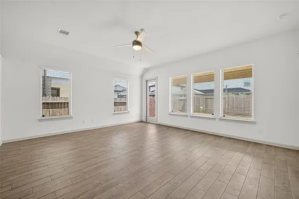 a view of kitchen with wooden floor and window