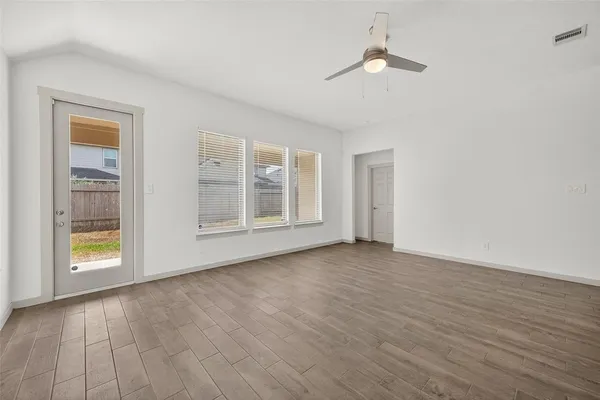 a large kitchen with stainless steel appliances granite countertop a stove top oven a sink and dishwasher