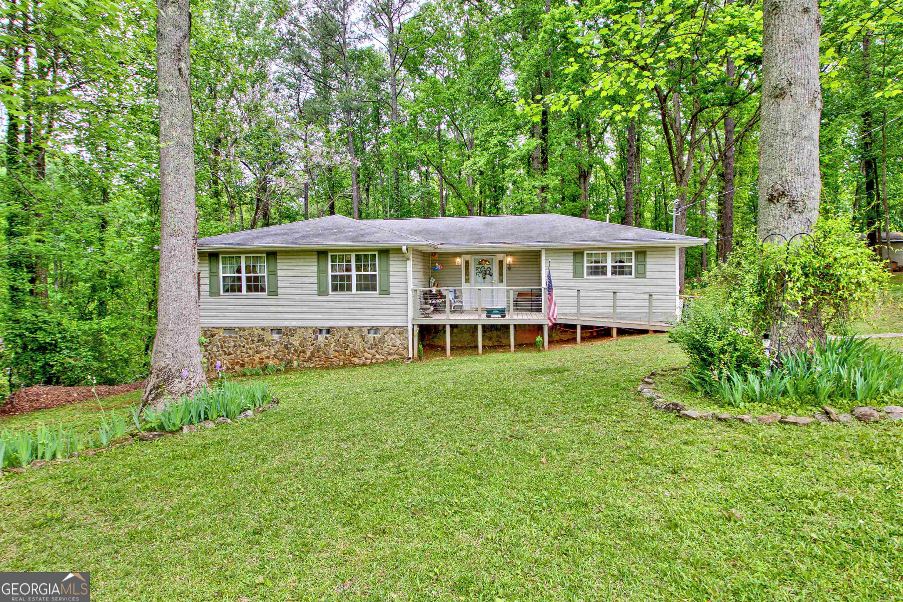 8309 Rivertown Road Fairburn, GA 30213 - Photo 1 of 1 a view of a house with a yard and sitting area