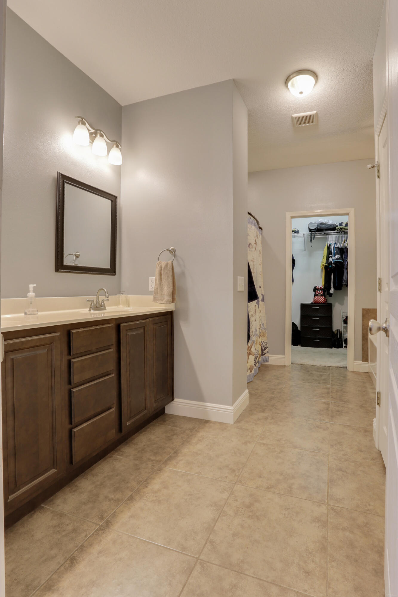 4539 Hermosa Road Crestview, FL 32539 - Photo 29 of 35 a bathroom with a sink double vanity and a mirror