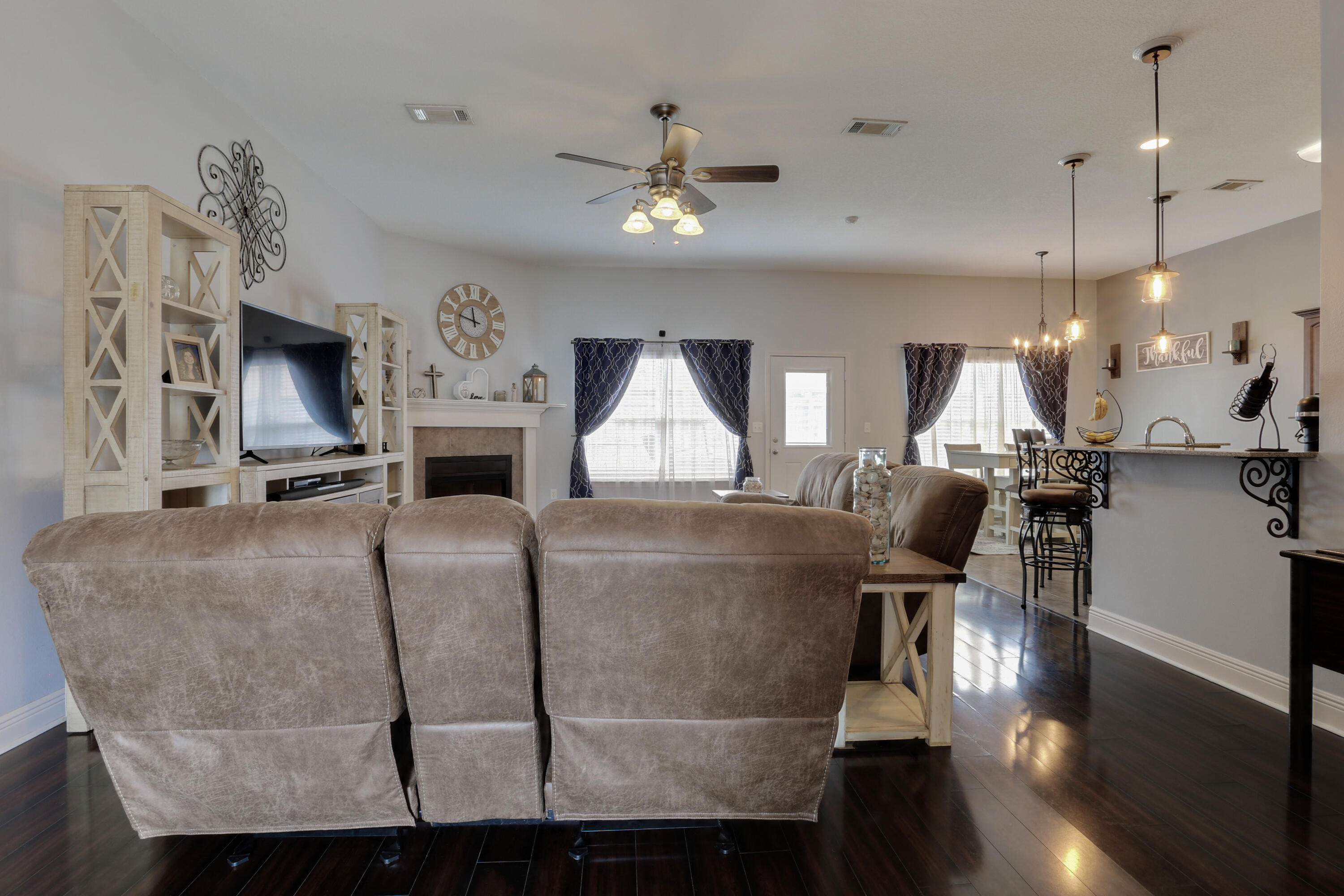 4539 Hermosa Road Crestview, FL 32539 - Photo 8 of 35 a living room with fireplace furniture and a wooden floor