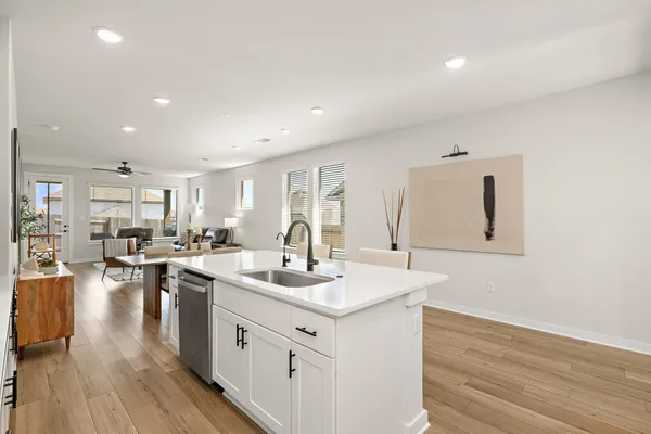 a kitchen with stainless steel appliances a refrigerator stove microwave and cabinets
