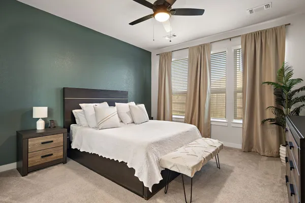 a kitchen with kitchen island a sink stove and refrigerator