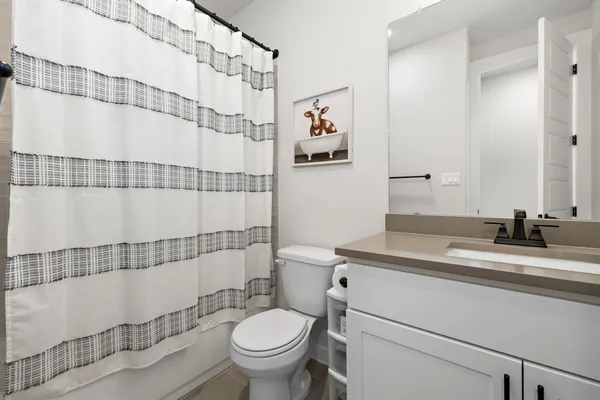 a bedroom with a bed and a chair