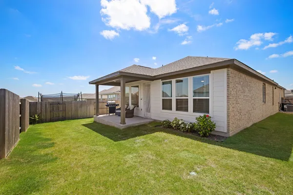 a view of a house with a yard porch and sitting area