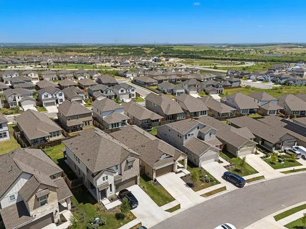 an aerial view of residential building with beach