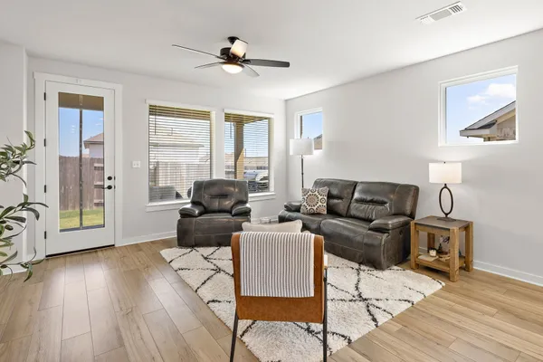 a living room with furniture and a window