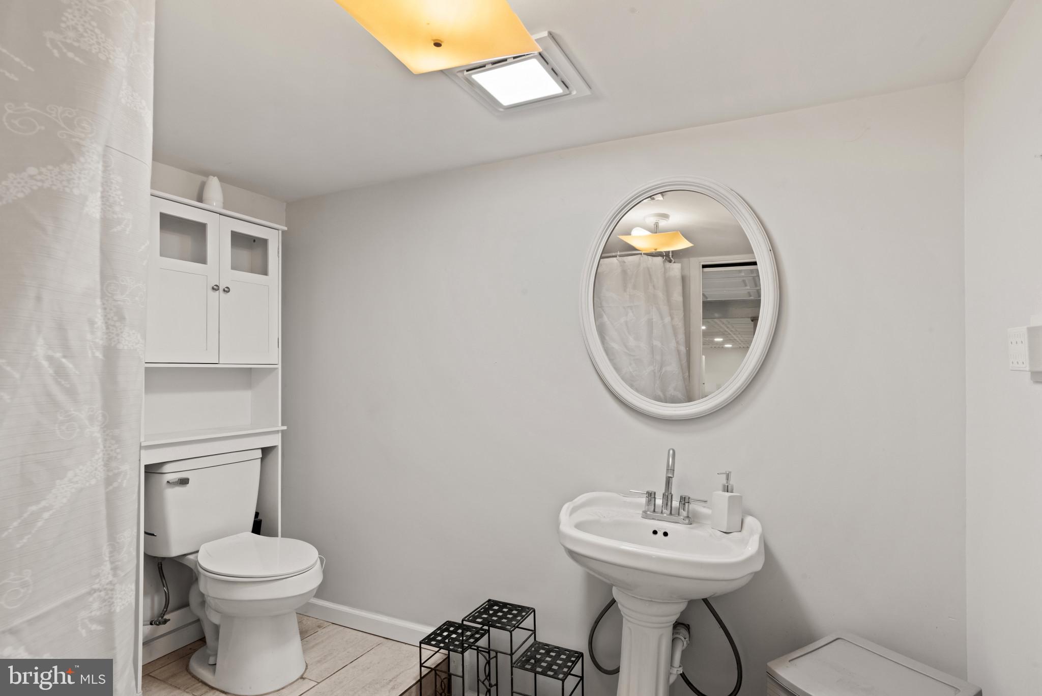 14 Sharon Road Enola, PA 17025 - Photo 26 of 40 Bathroom featuring a pedestal sink, oval framed mi