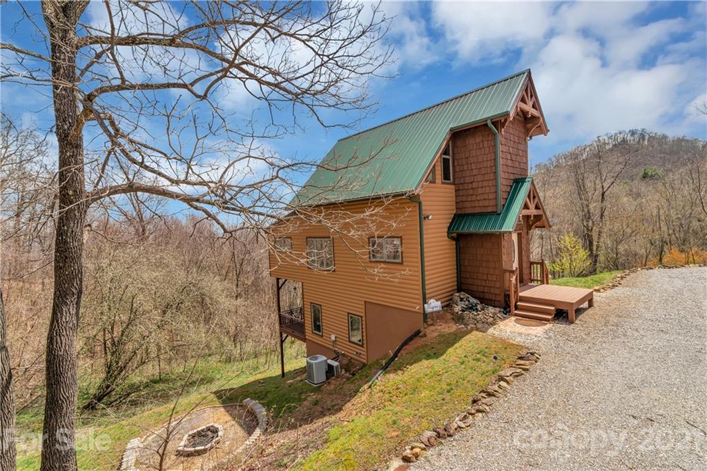 2794 Utah Mountain Road Waynesville, NC 28785 - Photo 2 of 27 a view of backyard with a patio