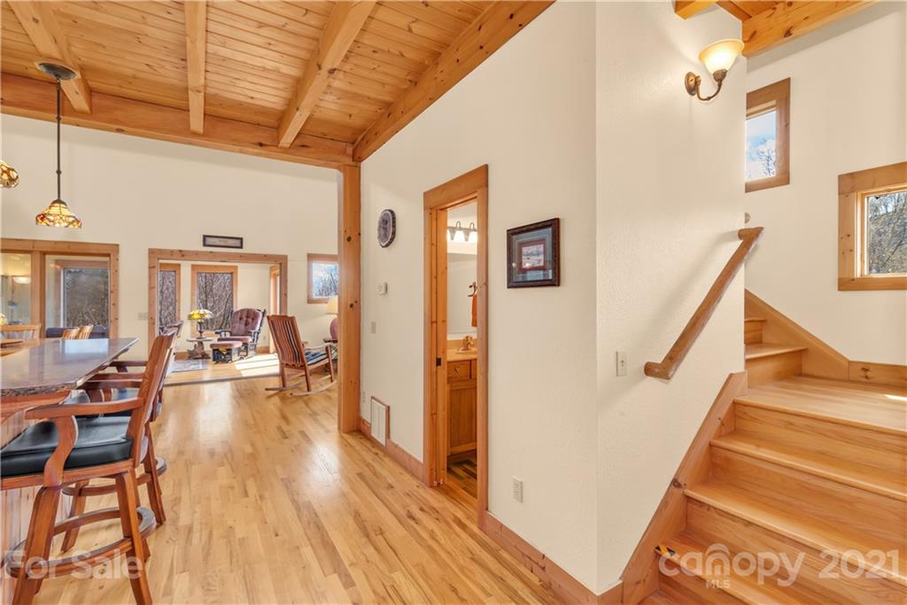 2794 Utah Mountain Road Waynesville, NC 28785 - Photo 5 of 27 a view of a living room with wooden floor and furniture