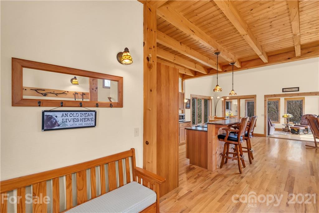 2794 Utah Mountain Road Waynesville, NC 28785 - Photo 6 of 27 a view of a hallway with wooden floor and furniture