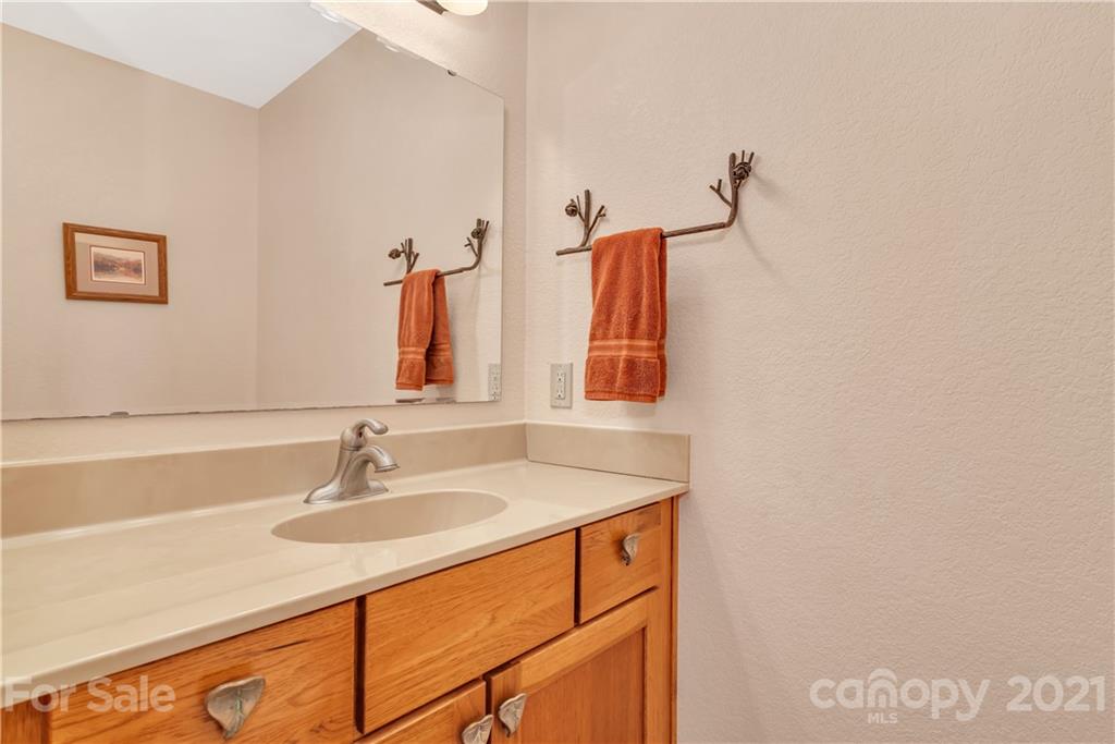 2794 Utah Mountain Road Waynesville, NC 28785 - Photo 10 of 27 a bathroom with a sink and a mirror