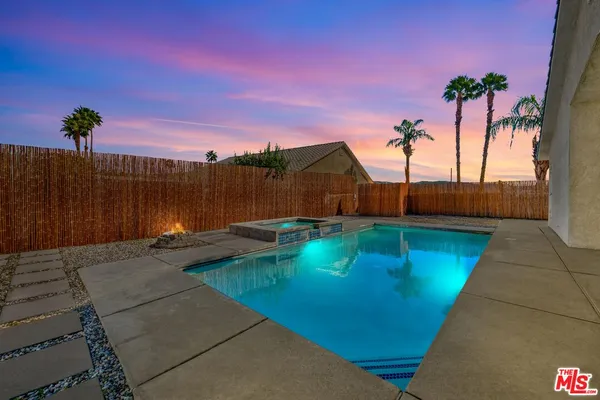 a kitchen with stainless steel appliances granite countertop a refrigerator stove and microwave