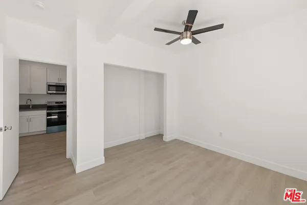 a kitchen with stainless steel appliances a refrigerator stove and sink