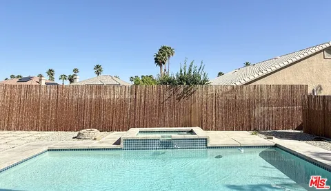a view of outdoor space with swimming pool and furniture