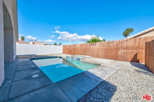 a bathroom with a sink double vanity and a mirror