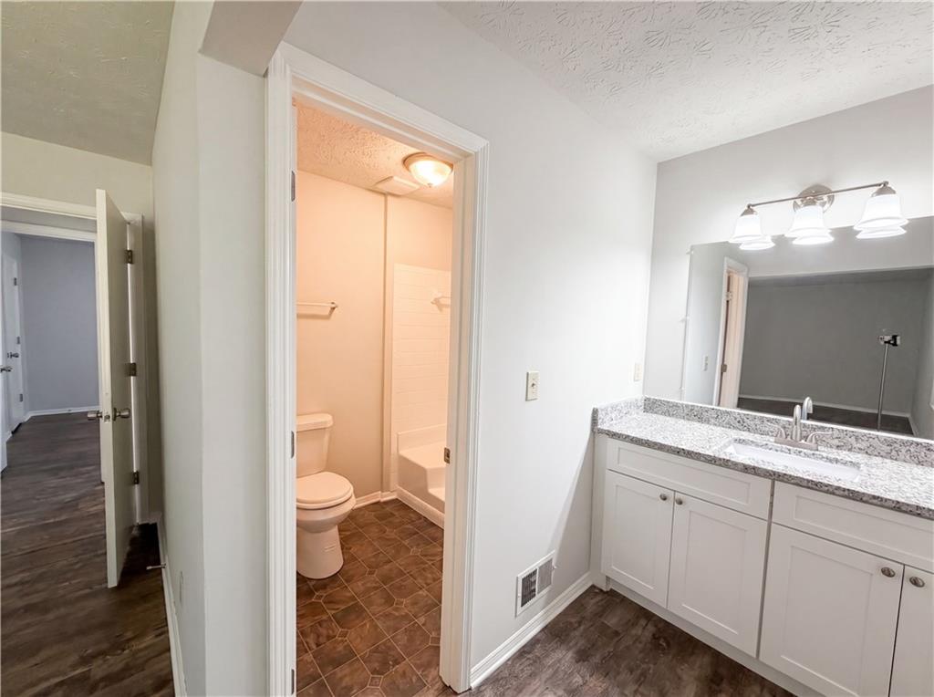 6830 Earlhurst Road Atlanta, GA 30349 - Photo 22 of 27 a view of a bathroom with a sink and a mirror