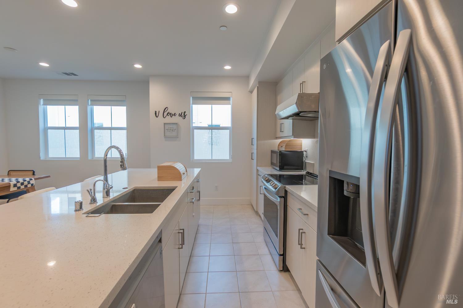 306 Rockview Road Novato, CA 94949 - Photo 13 of 37 a kitchen with stainless steel appliances granite countertop a sink a stove and a refrigerator